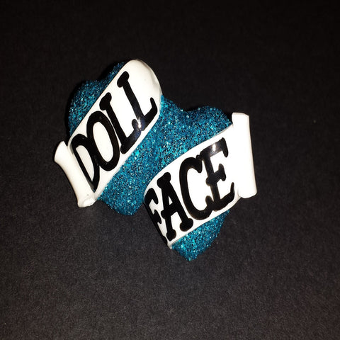 blue glittery doll face bete noire ring