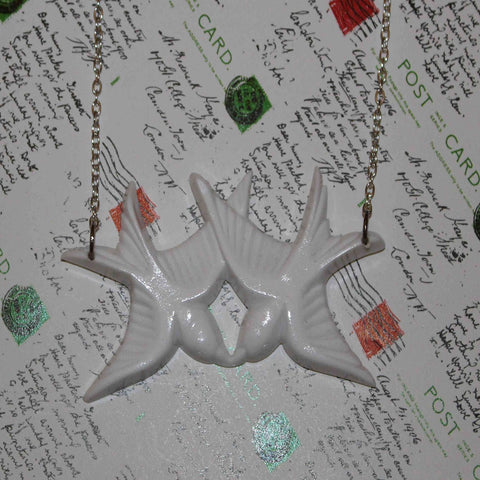 white birds of a feather swallows necklace