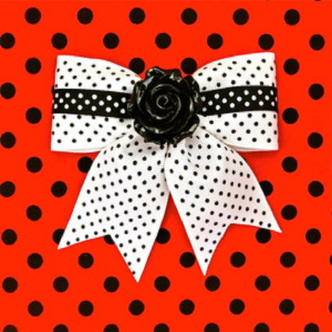 white polka pot with black flower hair bow by punk up bettie