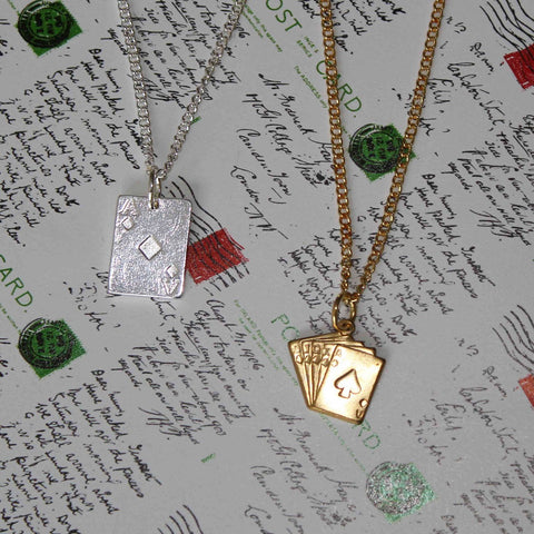 silver and brass tone ace of cards necklaces